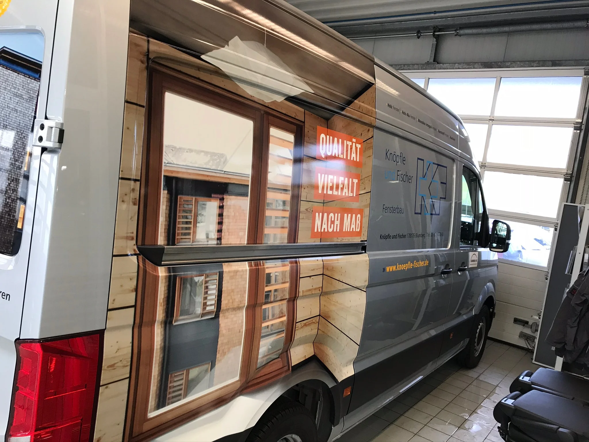 Vehicle with a custom design wrap and lettering in Tuningen